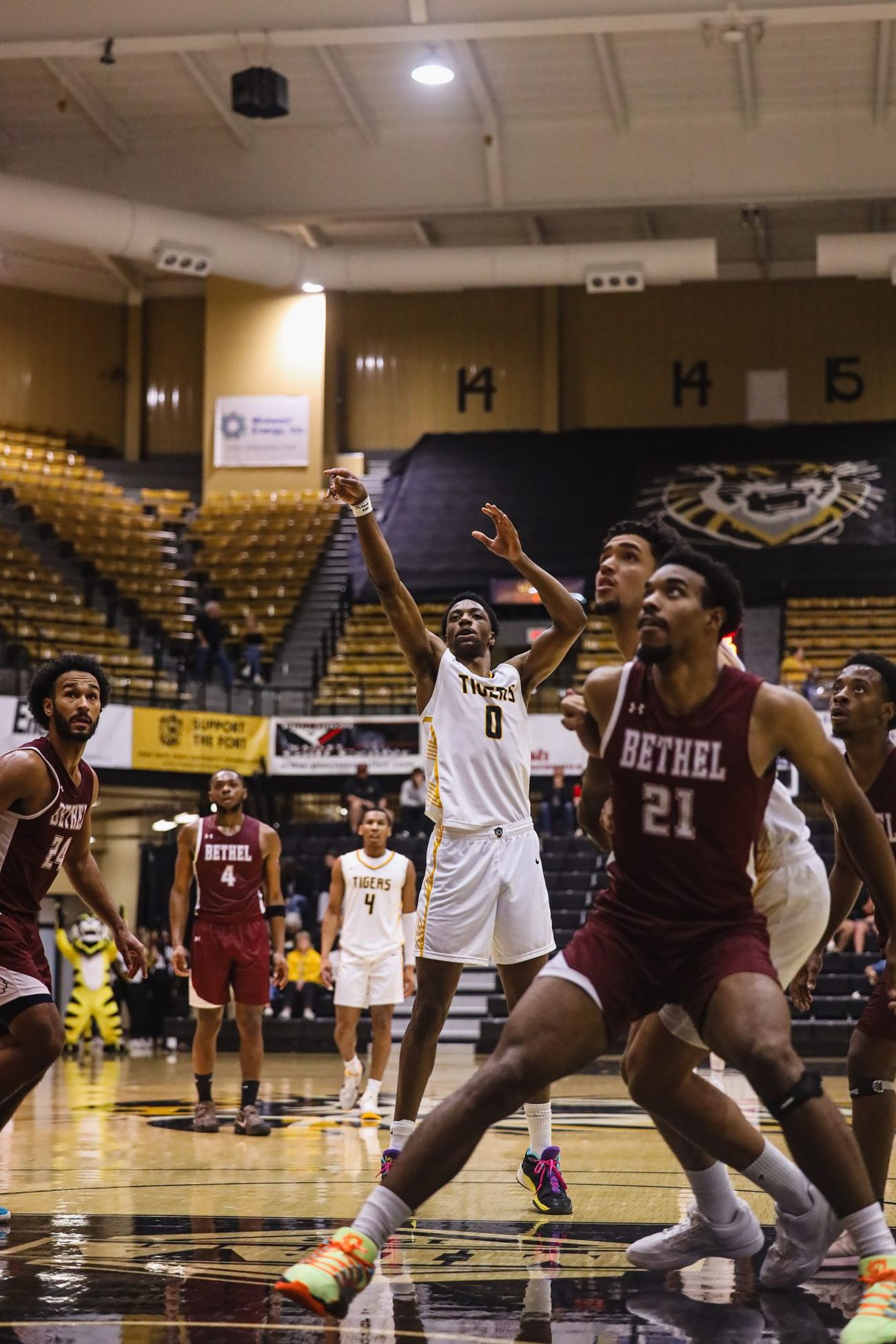 Men's basketball against Bethel, players boxing out under the basket